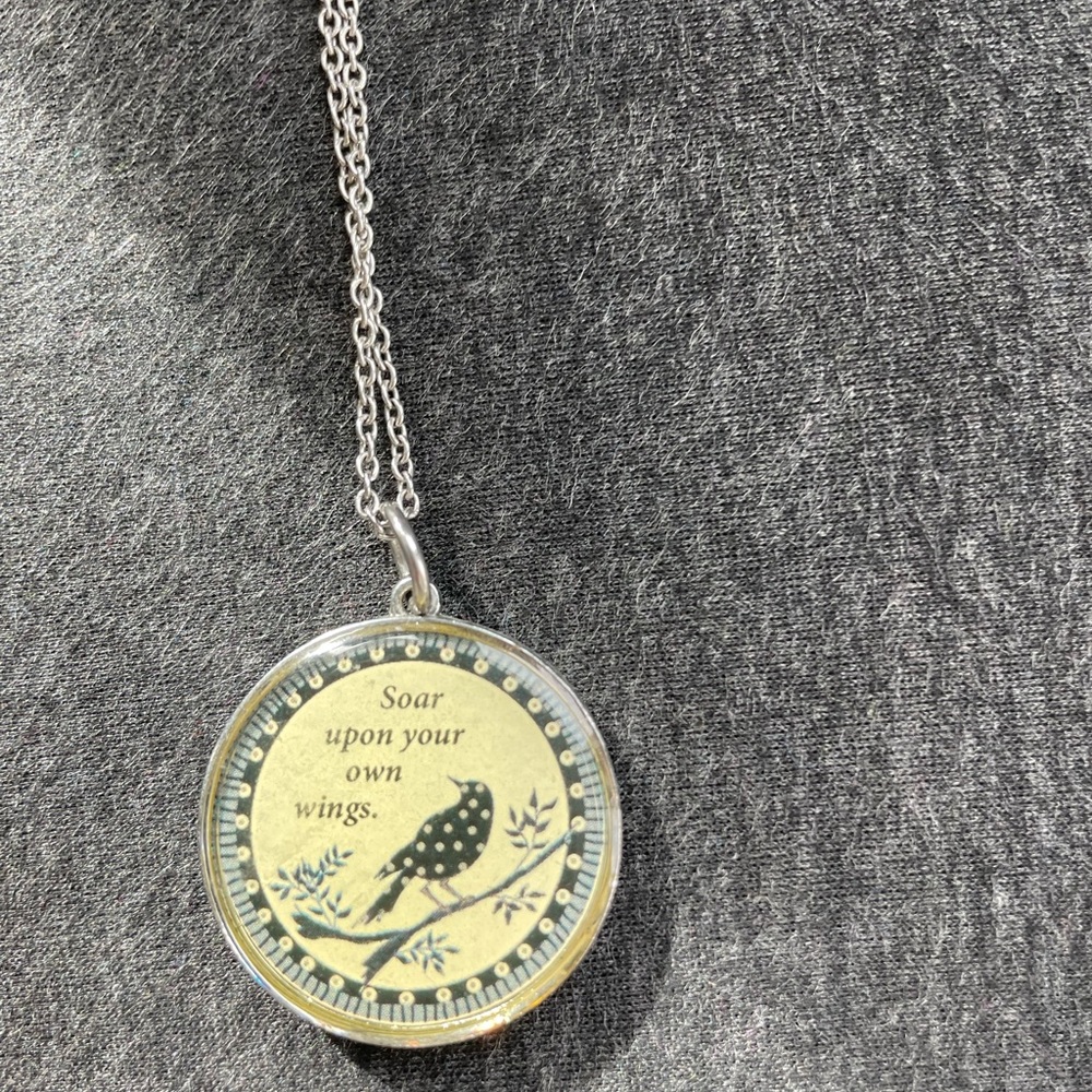 Bird-themed pendant- reversible with designs on both sides